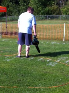 Leaf blowers drying the dew off the field